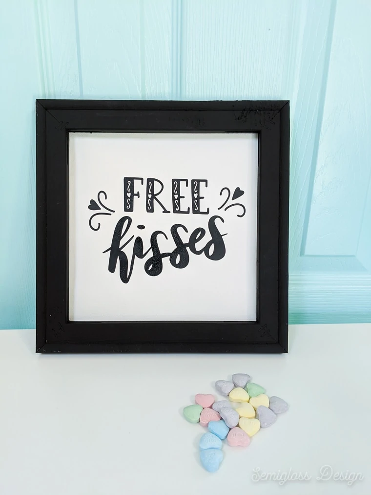 free kisses sign for Valentine's day with conversation heart candy