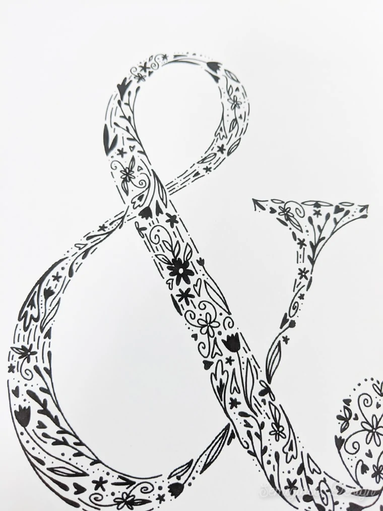 close up of floral ampersand art