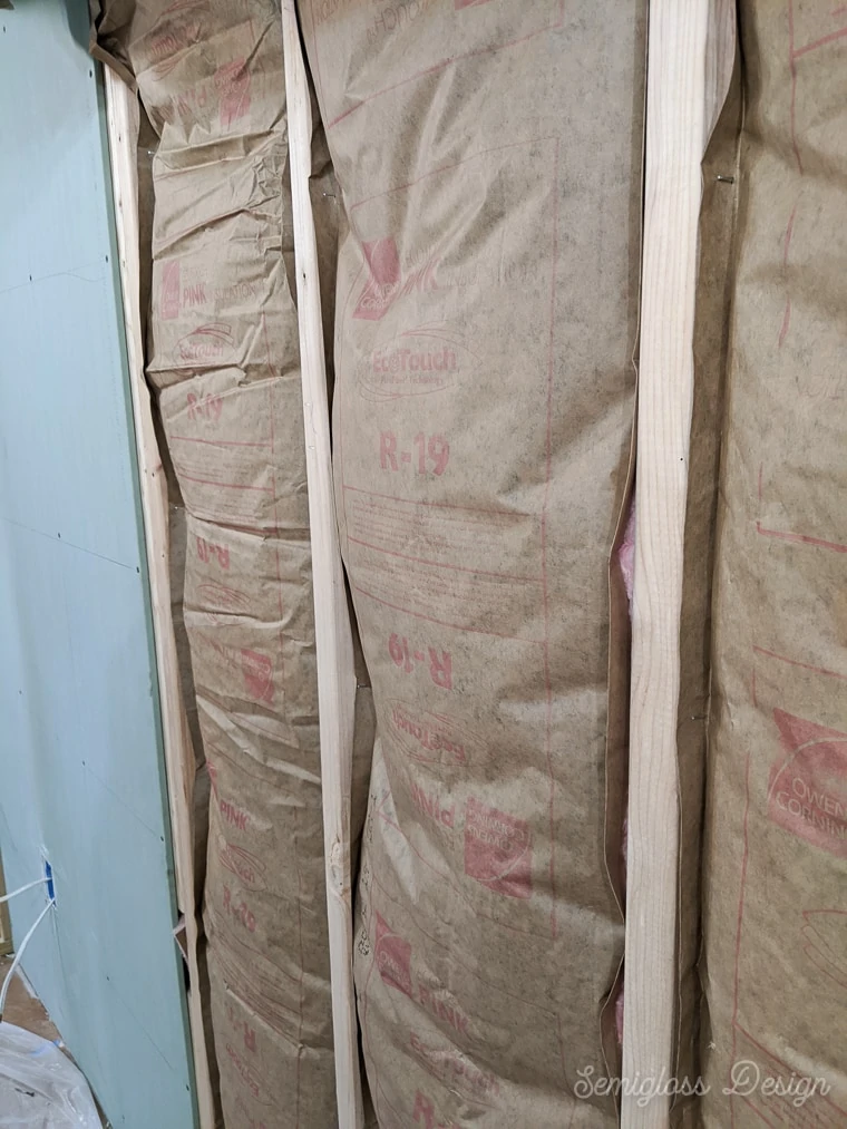 stapled sides of insulation to studs