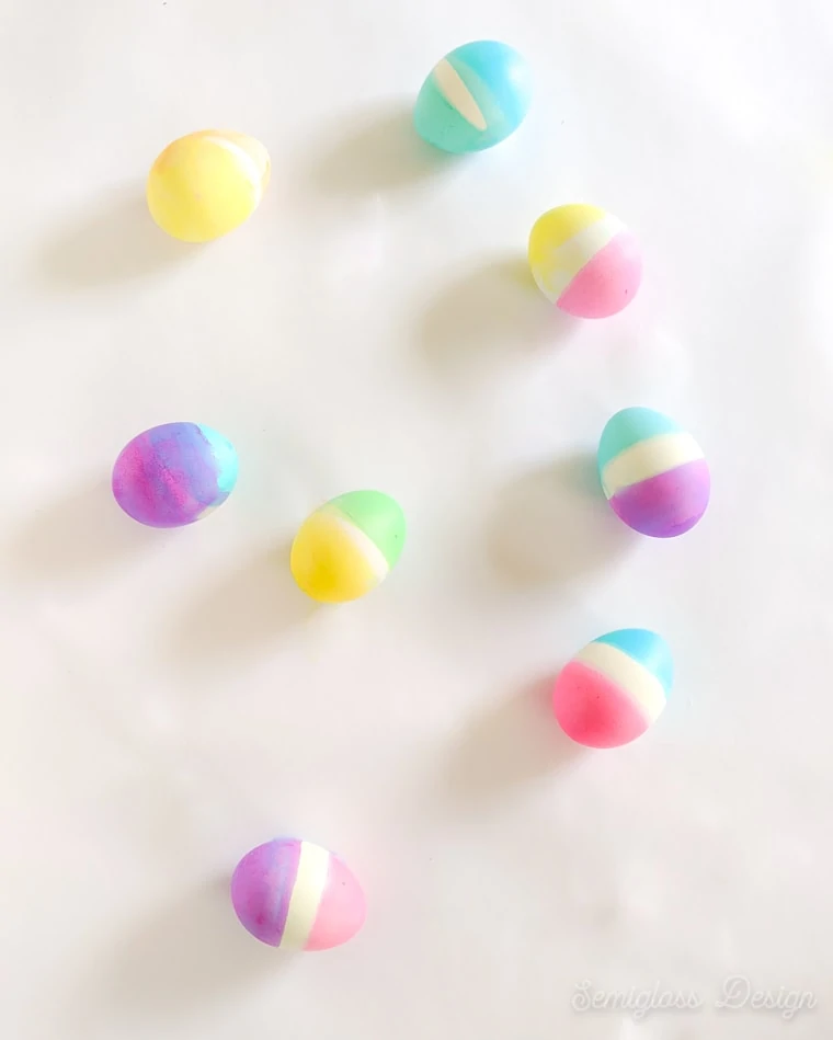 color blocked eggs on white background