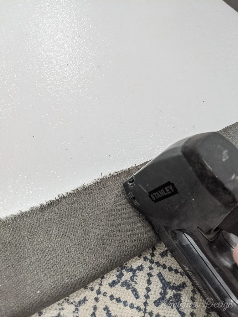 stapling fabric to foam board