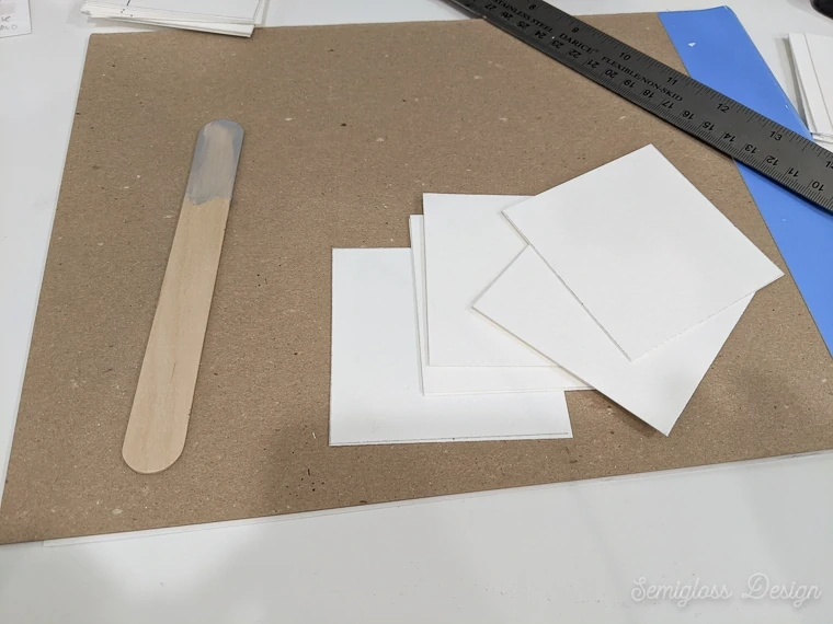 cut watercolor paper into squares