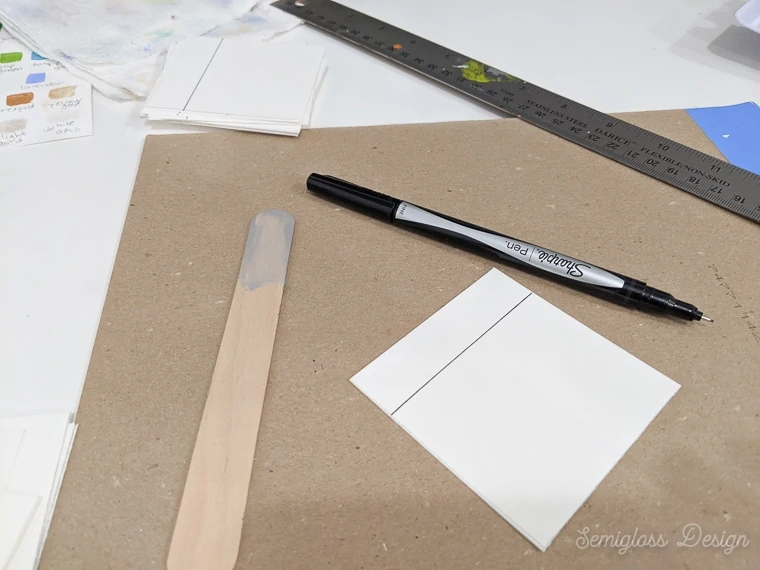 use waterproof pen to draw lines on watercolor paper for swatches