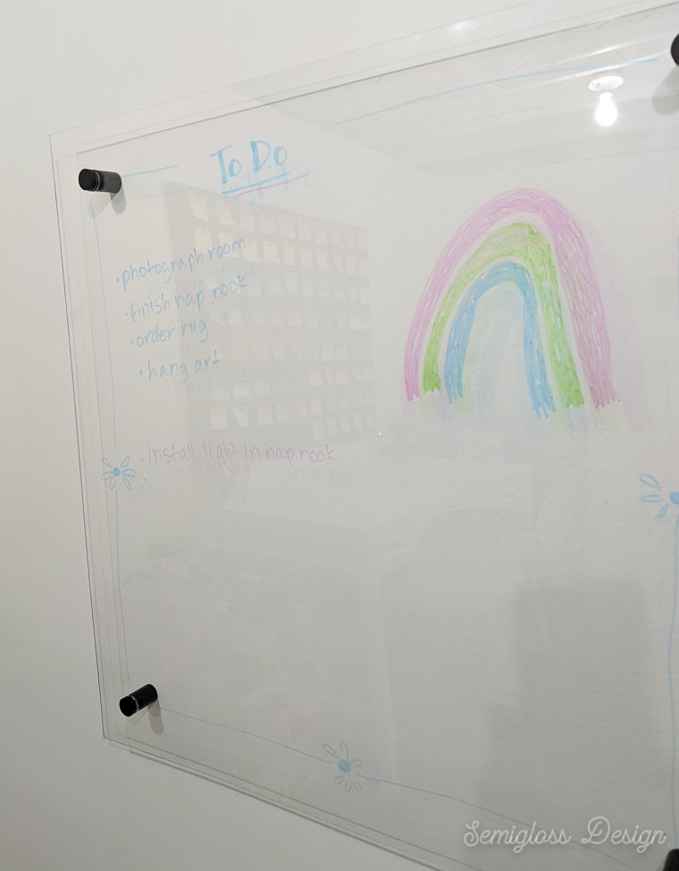clear dry erase board on white wall