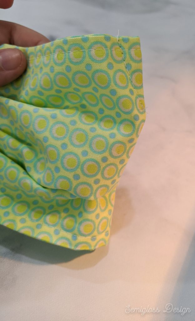 sewn pleat at nose of mask to make it fit better