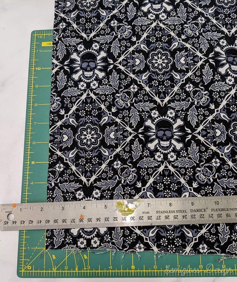skull fabric on cutting mat with ruler
