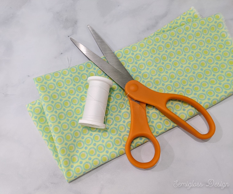 fabric, thread and scissors