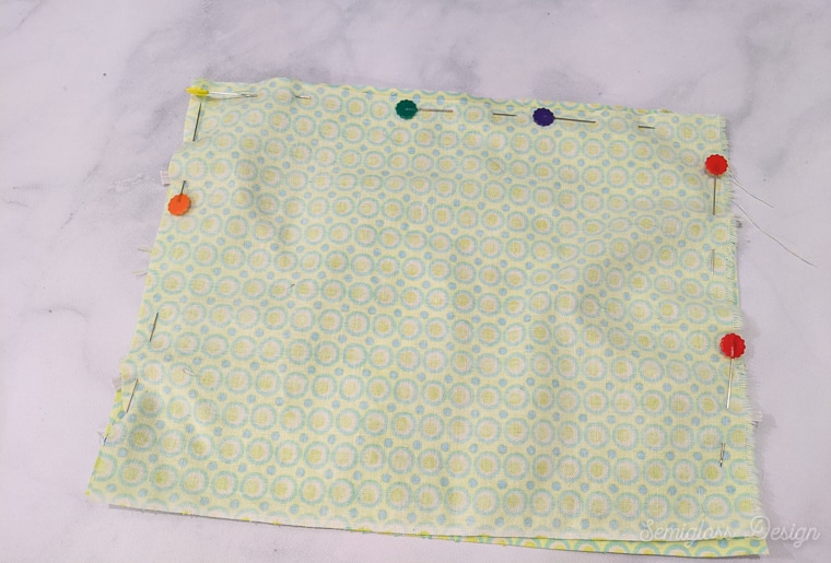 fabric pinned around edges