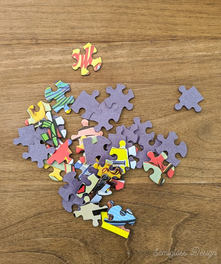 puzzle pieces on wooden table