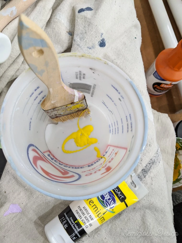 cup with glaze and yellow paint