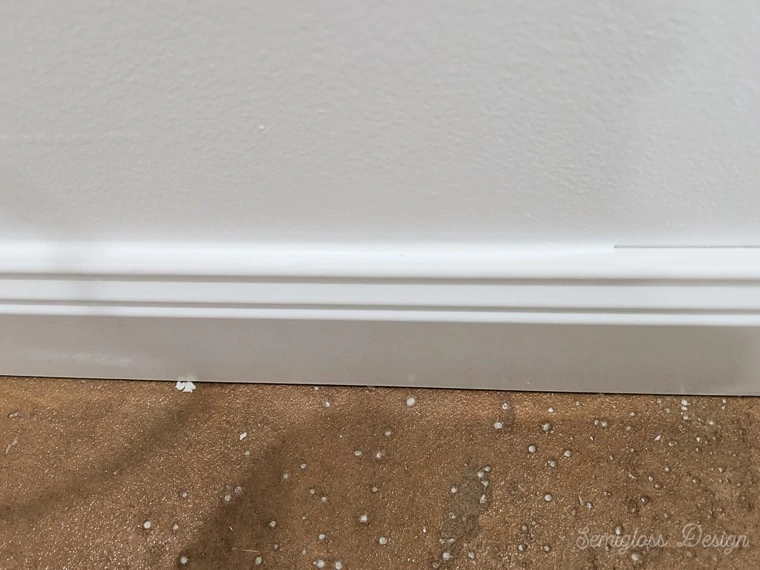 caulking edge of baseboard