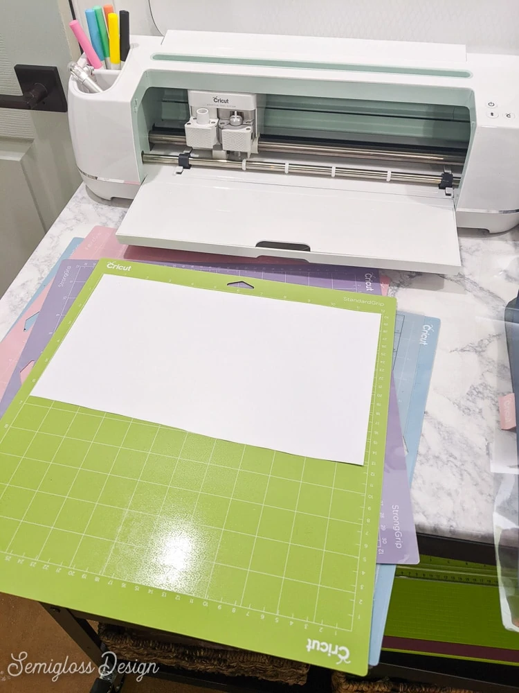 loading iron-on vinyl on mat, shiny side down