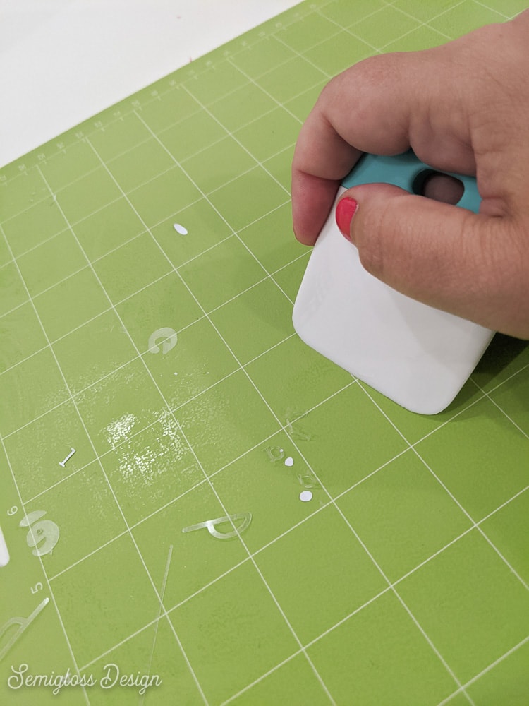 using cricut scraper to remove messed up cut from mat