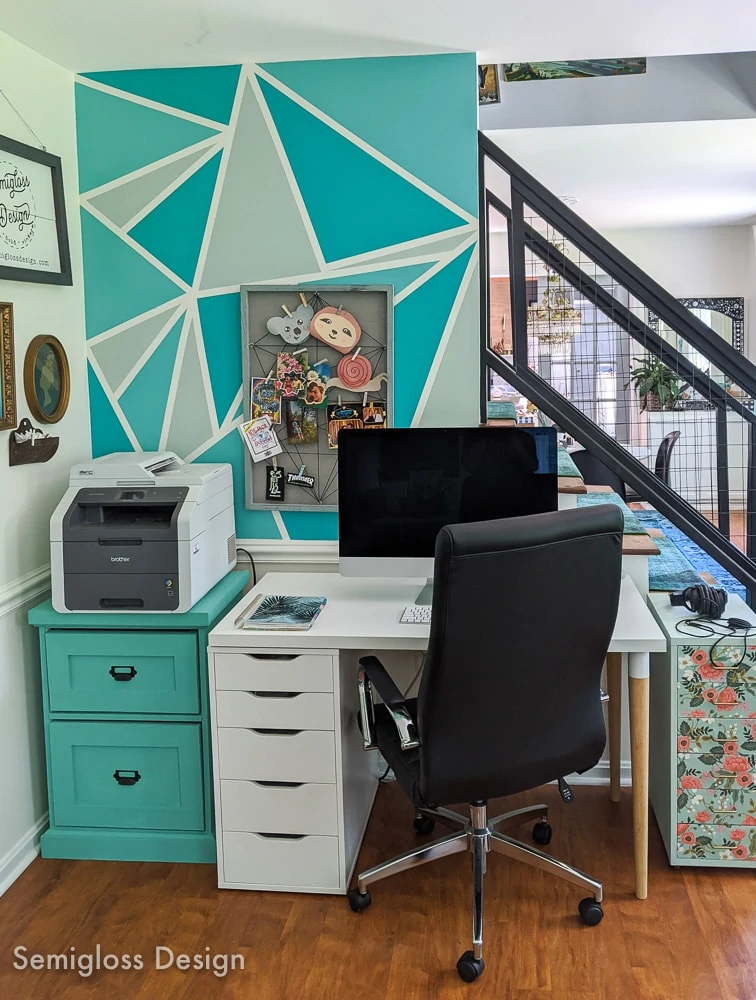 home office nook by staircase with teal triangle wall mural