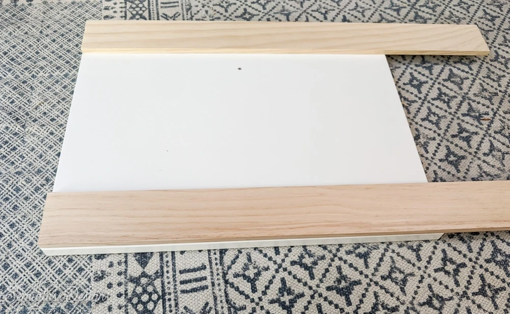 measuring wood against drawer panels