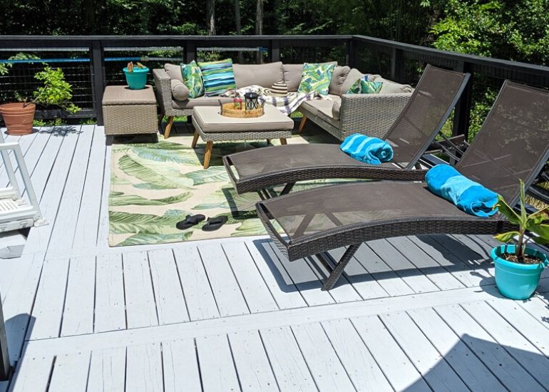 wood deck, painted gray with patio furniture