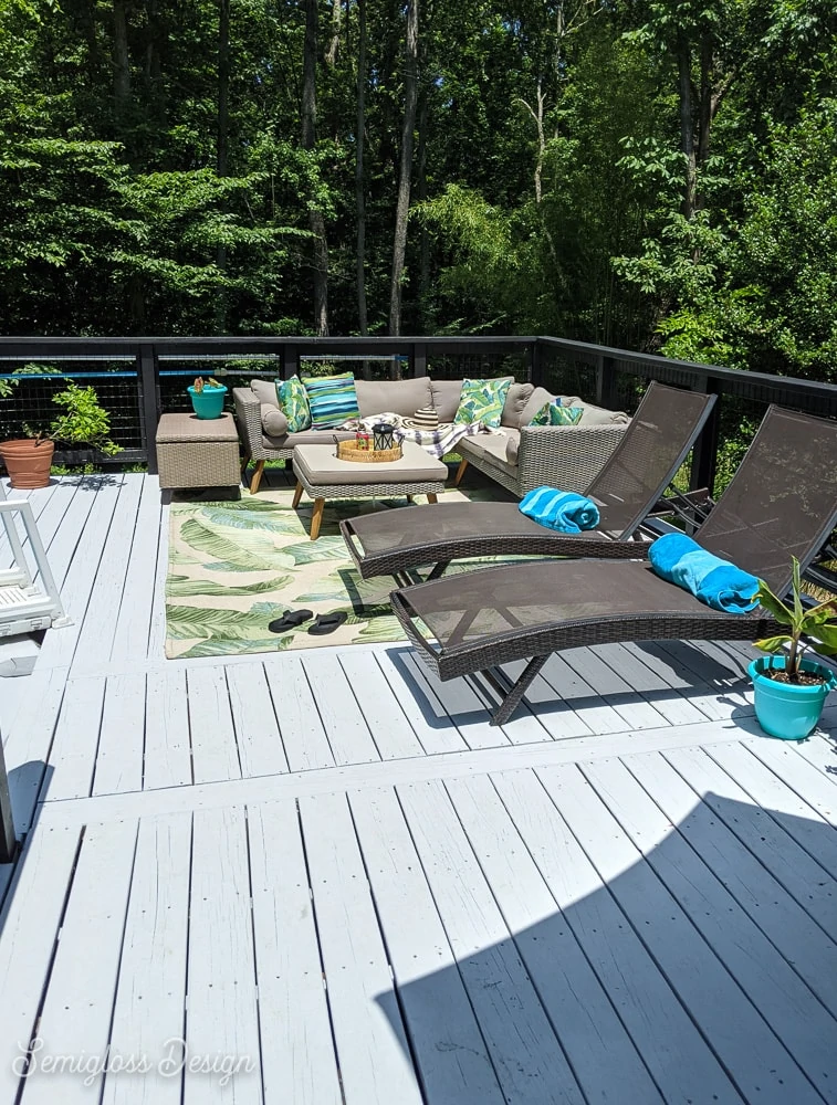 painted gray deck with patio furniture