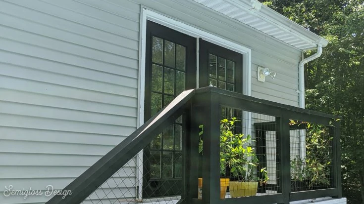 black French doors with small deck