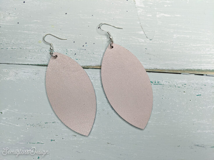 rose gold leather earrings DIY on aqua wood background
