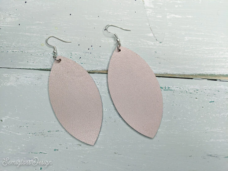 rose gold leather earrings DIY on aqua wood background