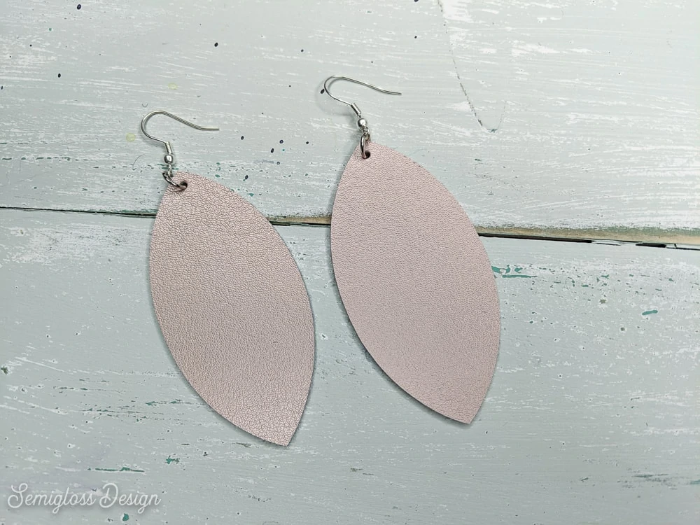 rose gold leather earrings DIY on aqua wood background