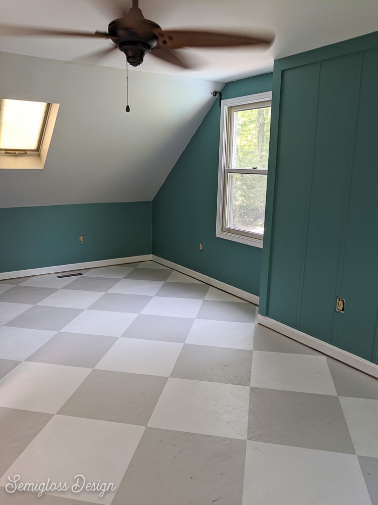 room painted teal color with checkerboard painted floors