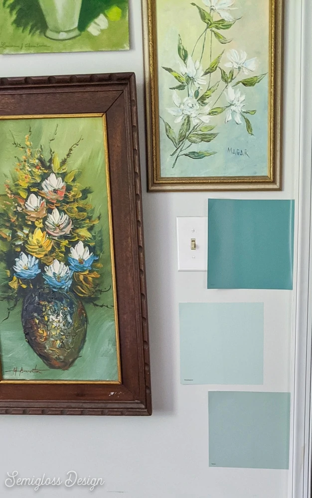 teal paint swatches on wall