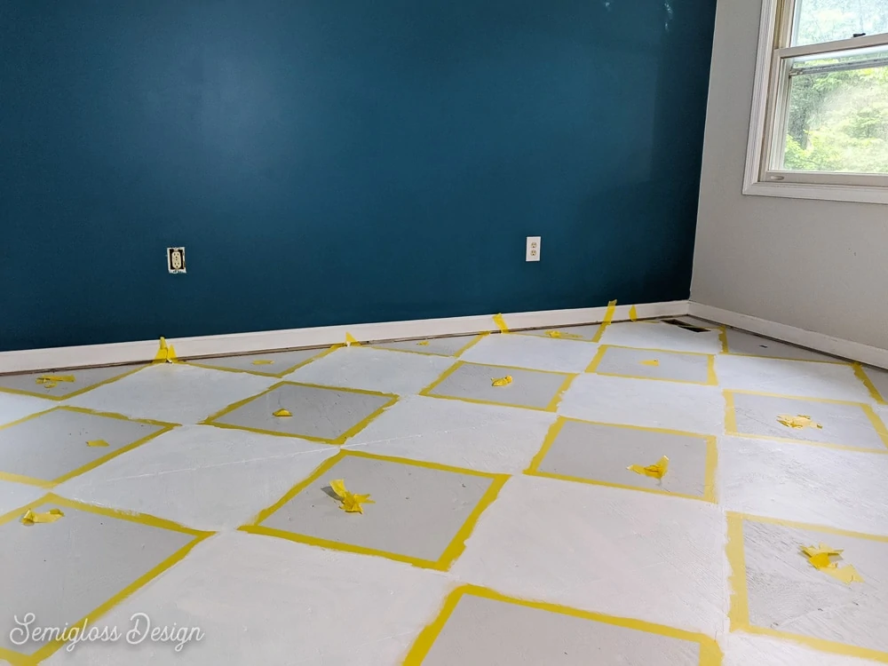 painting a floor with a checkerboard pattern