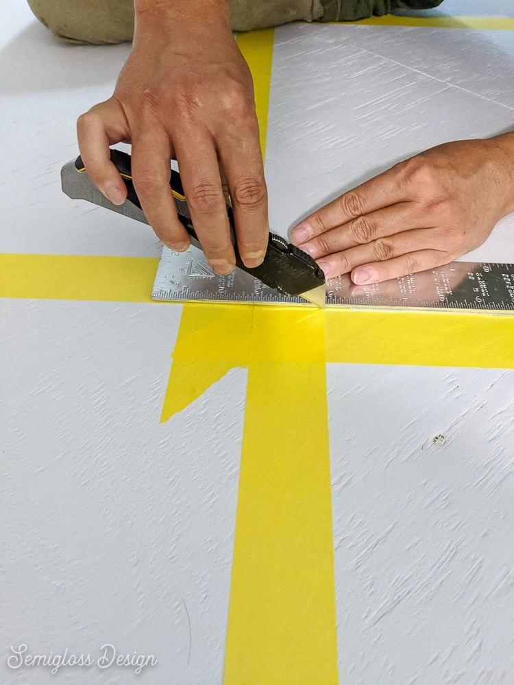 cutting corners of tape with utility knife