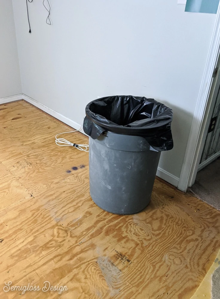 trash can for demo debris when removing carpet from room