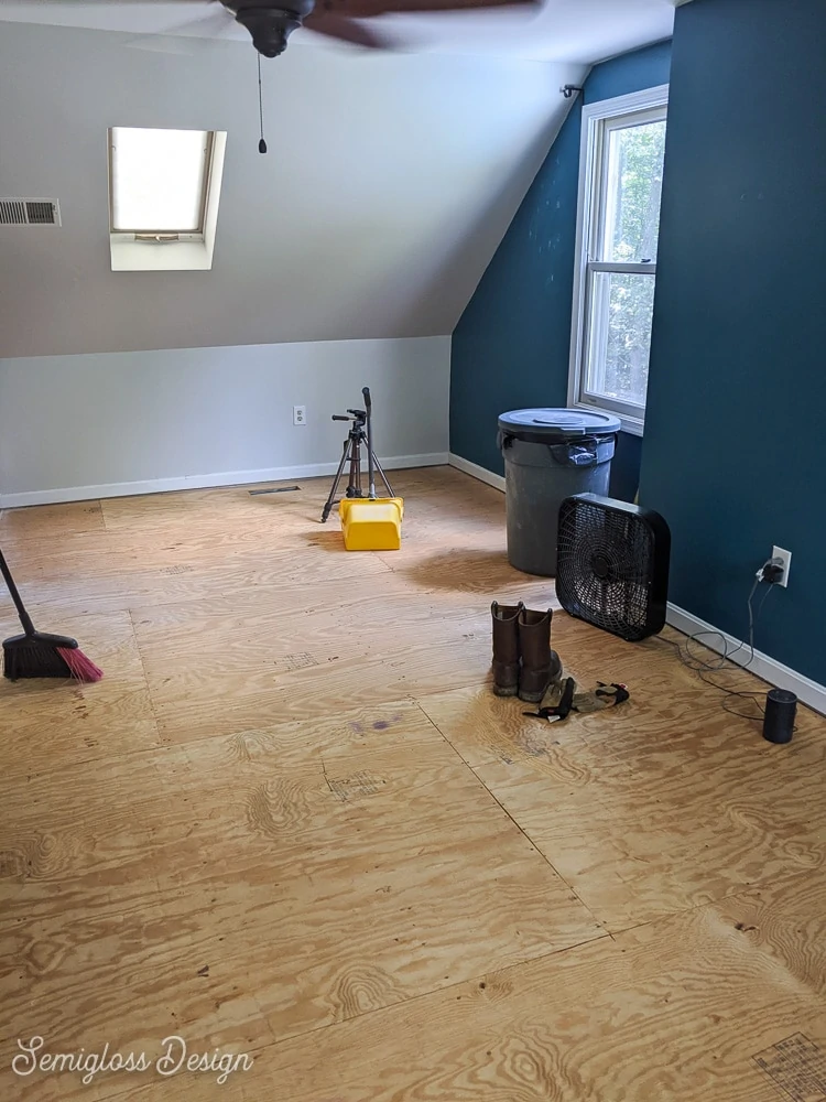 bare plywood floor after removing carpet