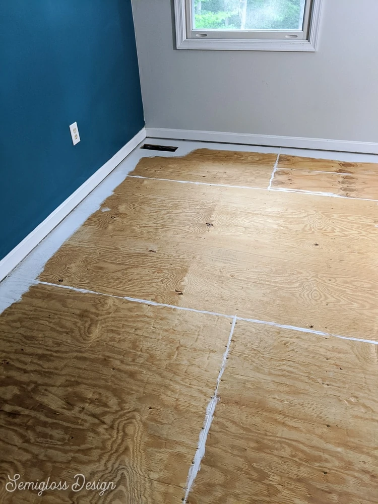 painting edges of floor in room