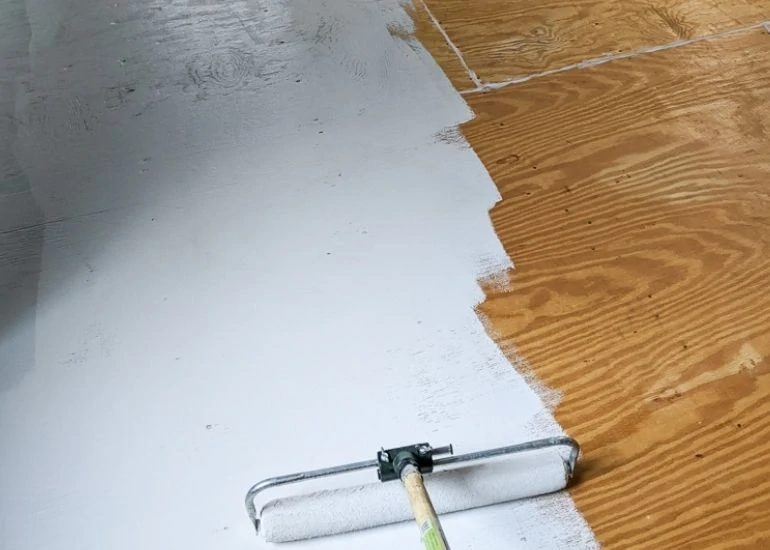 paint a plywood floor with light gray paint