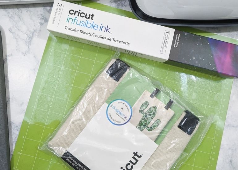 cricut infusible ink and tote bag package on green mat