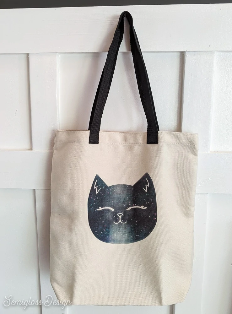 cat tote bag hanging against wall