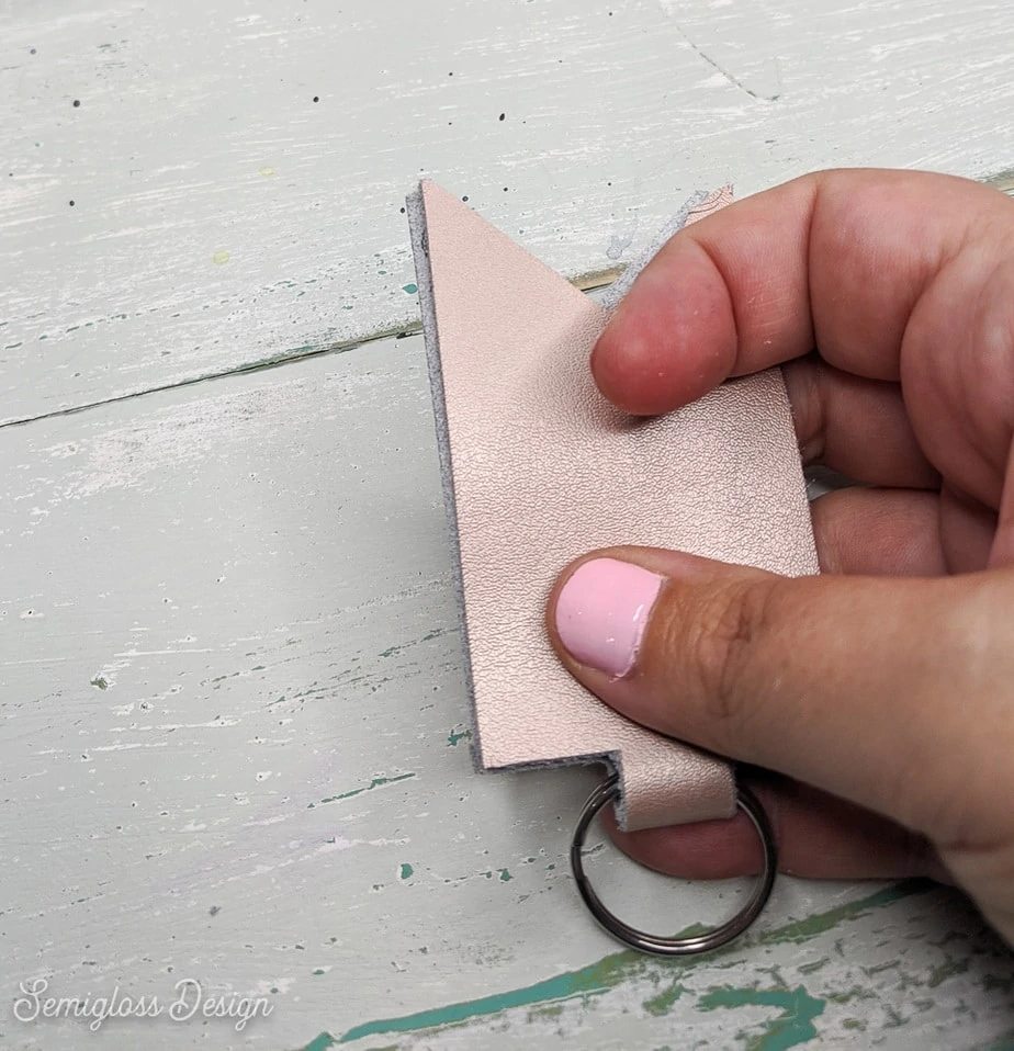 pressing leather onto glued surface