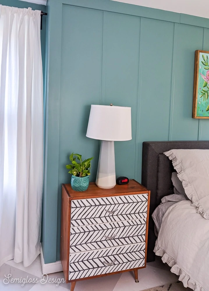 ikea rast dresser with black and white wallpaper against teal walls