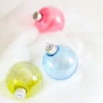 ornaments in green, blue, and red