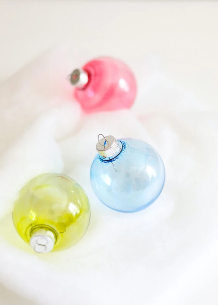 ornaments in green, blue, and red