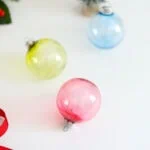 solid colored alcohol ink ornaments in red, green, and blue