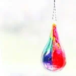 tear drop shaped ornament with rainbow colored alcohol ink effect