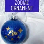 blue glitter ornament with Leo constellation decal