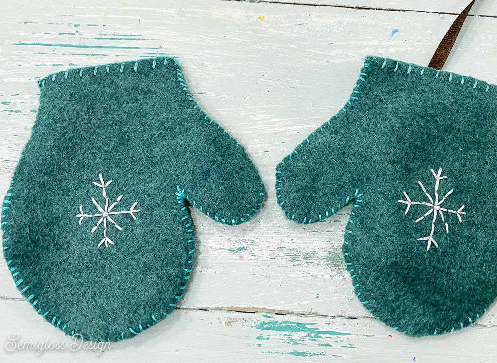 felt mittens with embroidered snowflakes