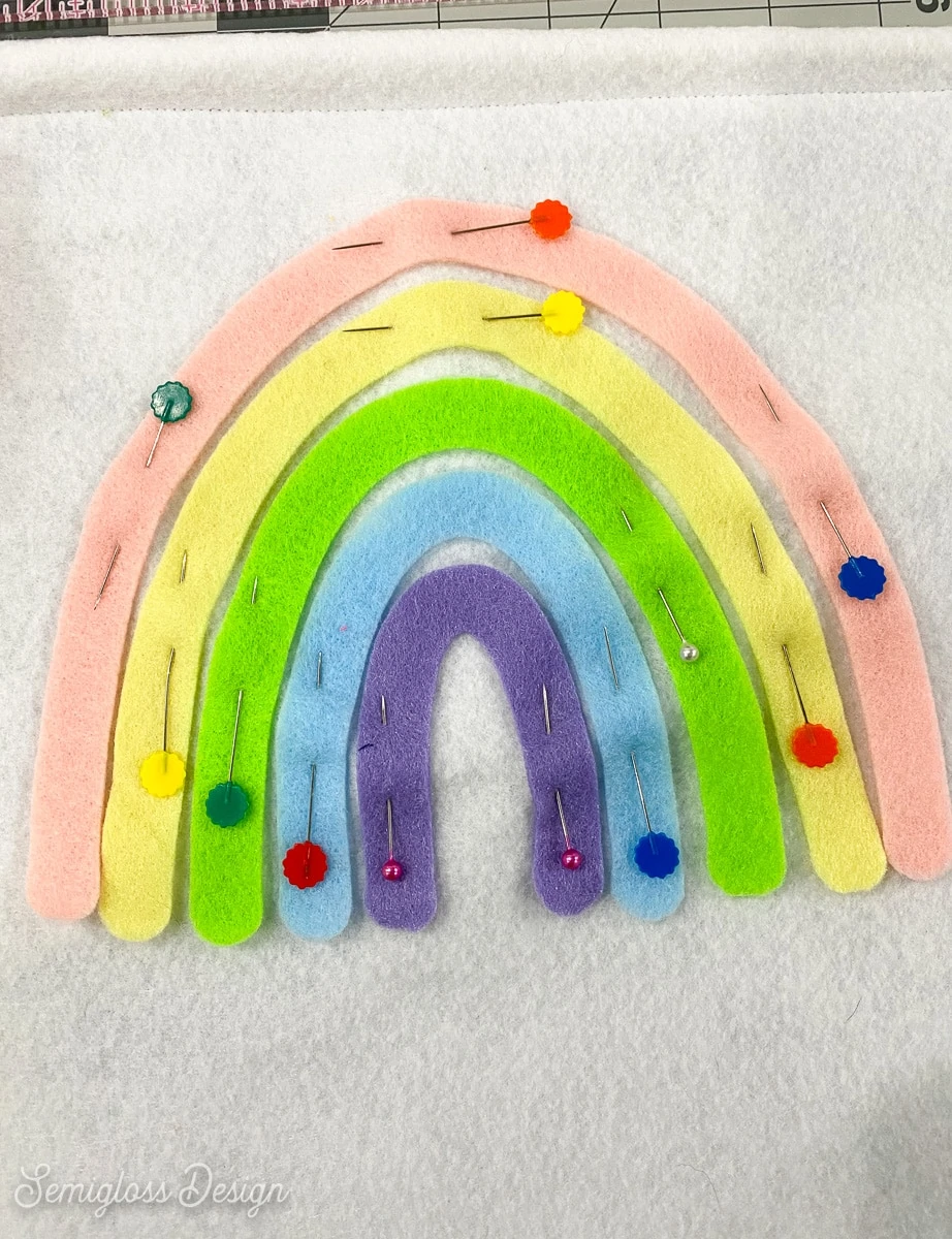 pinned felt rainbow on wall hanging