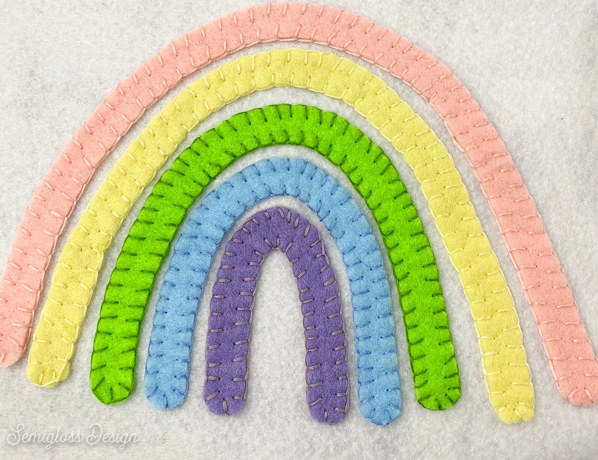 rainbow sewn onto felt with embroidery floss