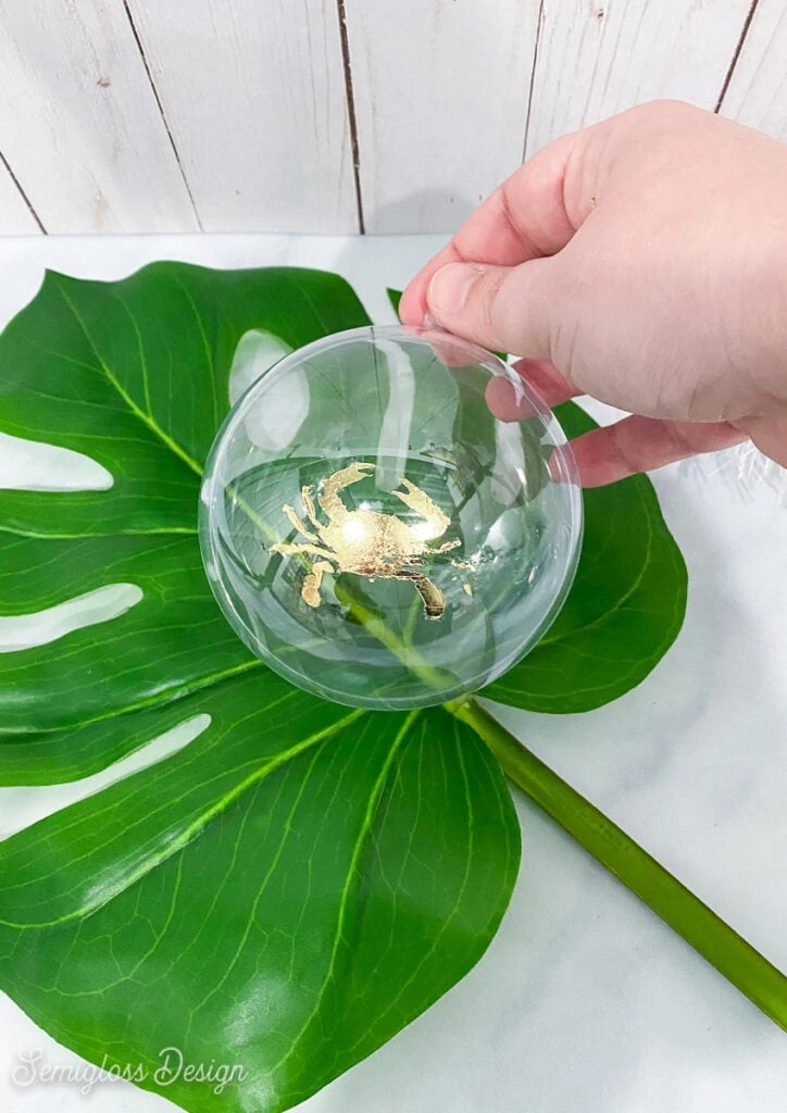 crab ornament on tropical leaf