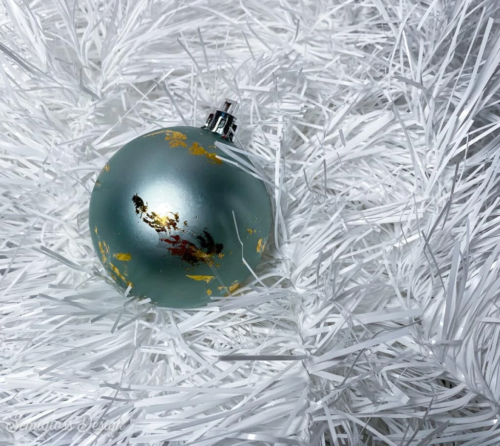 plastic ornament with gold leaf