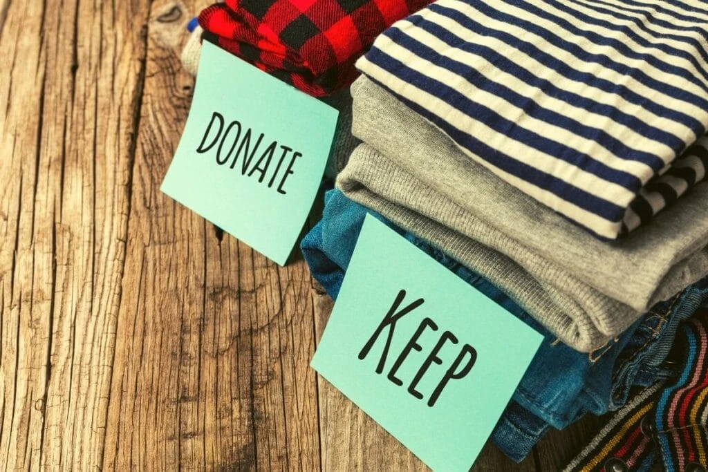 donate and keep piles of clothing