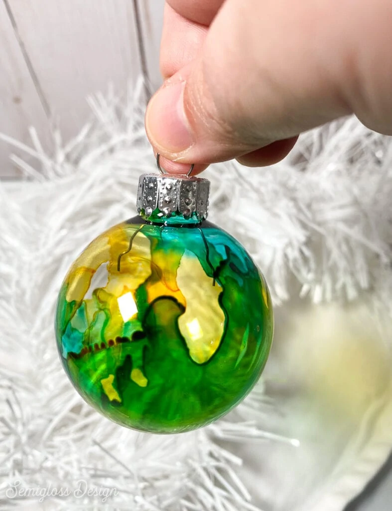 green and yellow glass ornament