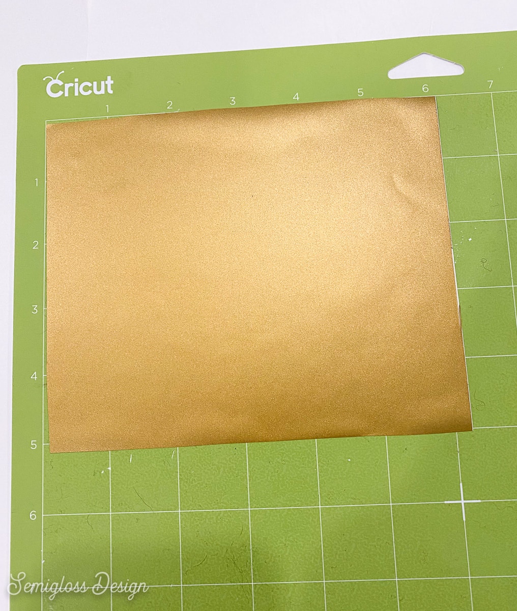 gold vinyl on green cutting mat